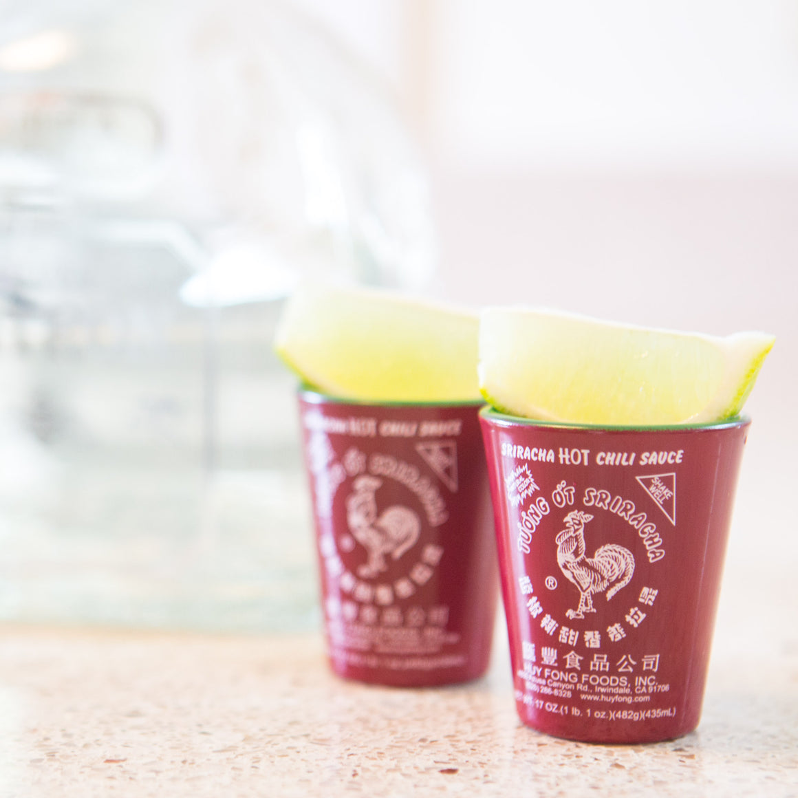Sriracha Shot Glasses With Tequila And Limes