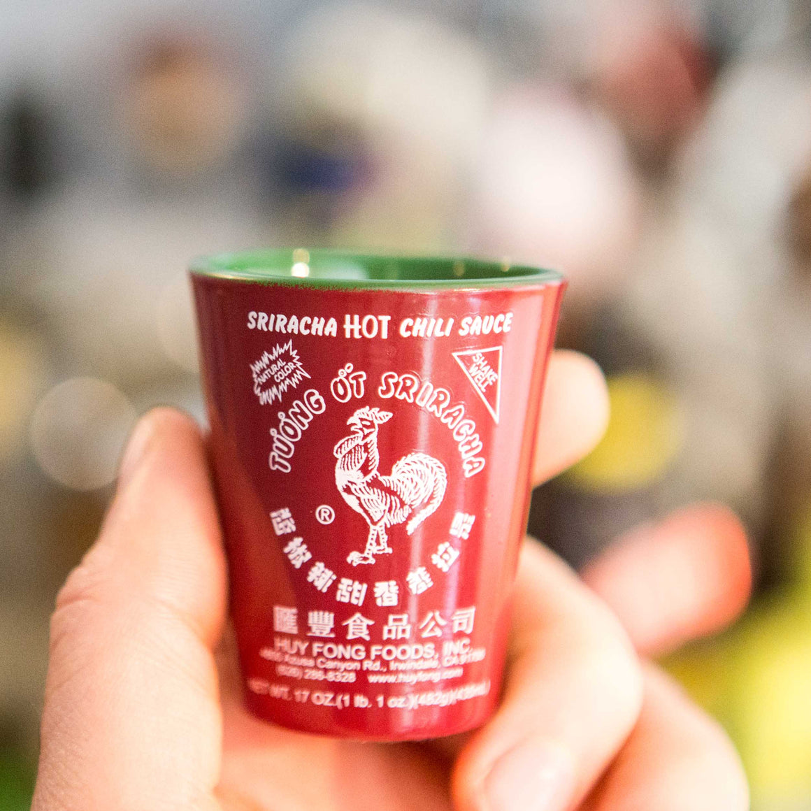Sriracha Shot Glass Held In Hand